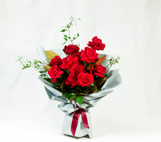 A bold and romantic classic, love story flowers in a vase.