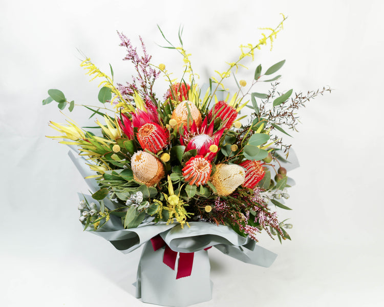 Complementary flowers and foliage arranged with our finest Australian and South African native flowers